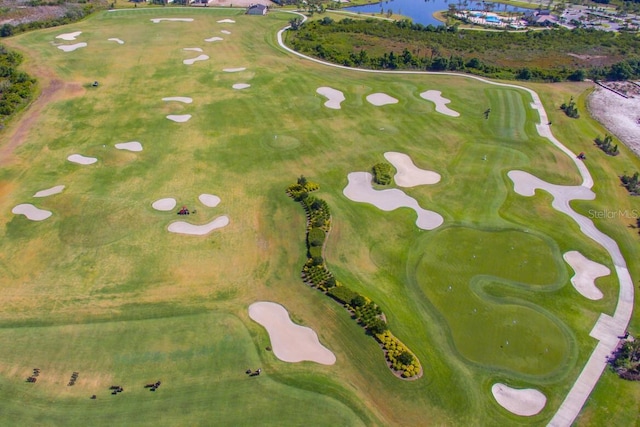 aerial view featuring a water view and view of golf course