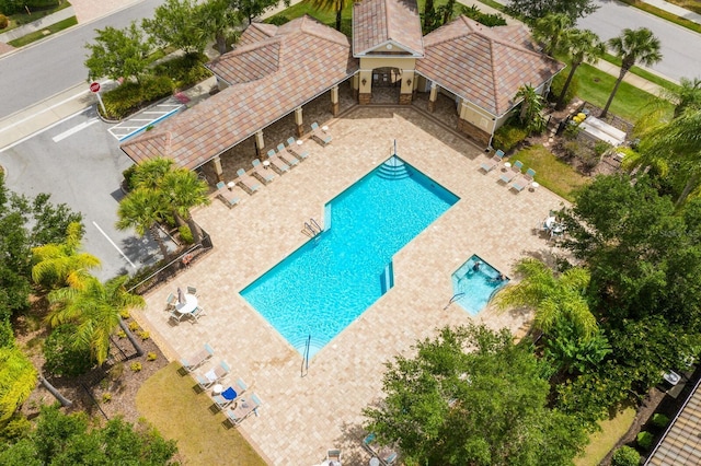 community pool with a patio area