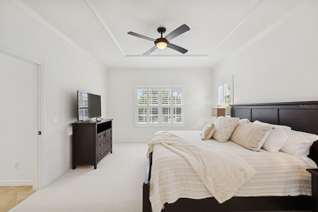 bedroom featuring a ceiling fan, ornamental molding, baseboards, and light colored carpet