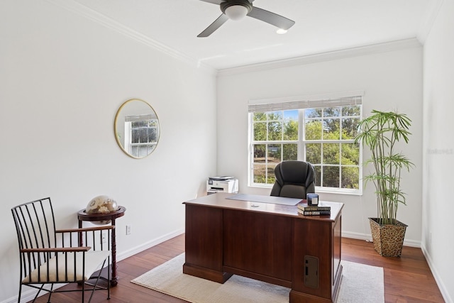 office area with ornamental molding, wood finished floors, and a ceiling fan