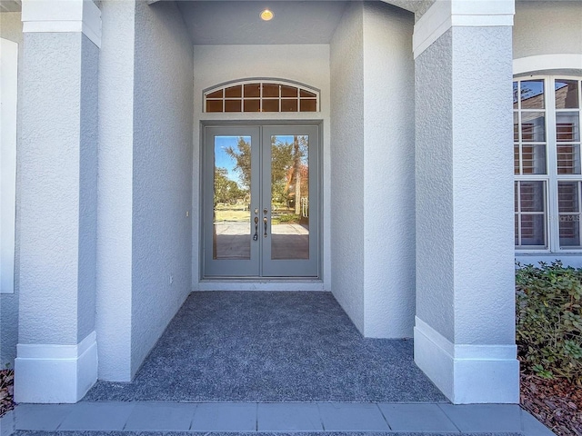 entrance to property featuring french doors