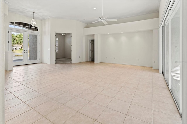 interior space with french doors, ceiling fan, and ornamental molding