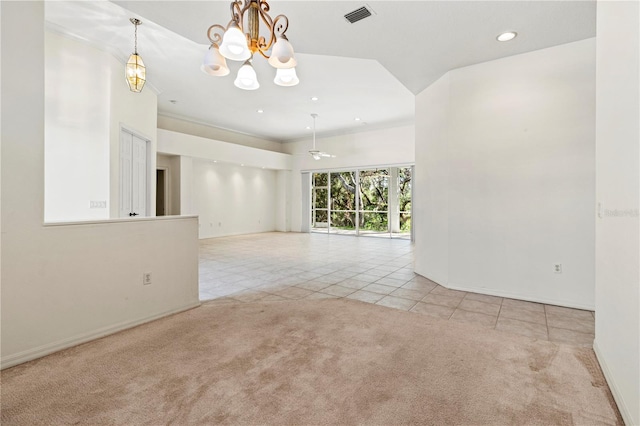 carpeted empty room with a chandelier