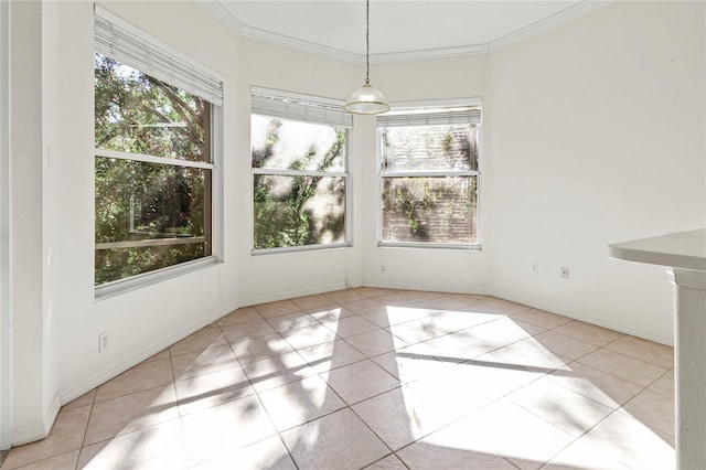 unfurnished dining area featuring crown molding and light tile patterned flooring