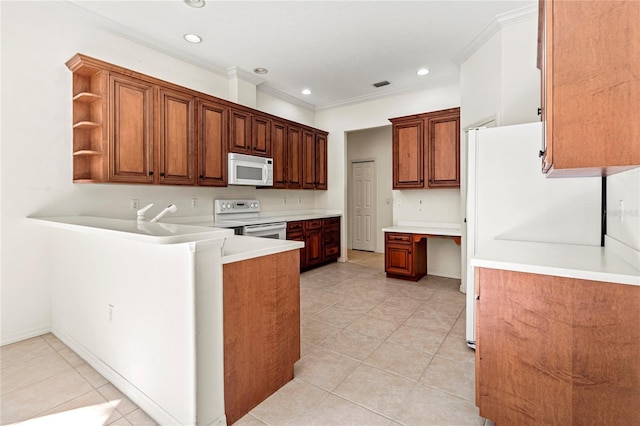 kitchen featuring white appliances, kitchen peninsula, light tile patterned floors, and built in desk