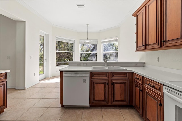 kitchen with sink, hanging light fixtures, light tile patterned floors, ornamental molding, and dishwasher