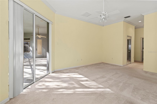 carpeted empty room with crown molding and ceiling fan