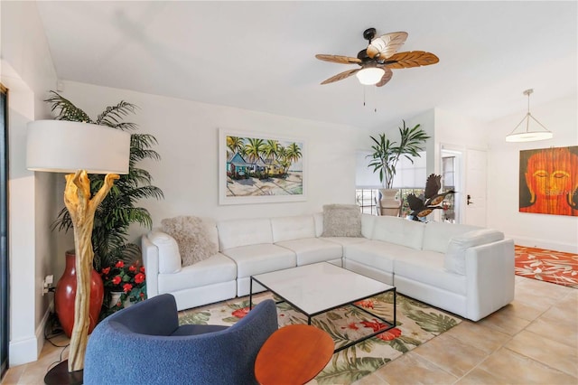 living room with ceiling fan and light tile patterned floors