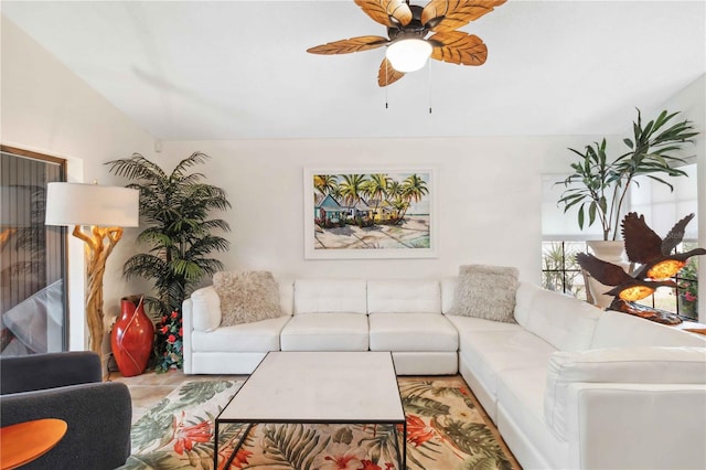 living room featuring vaulted ceiling and ceiling fan