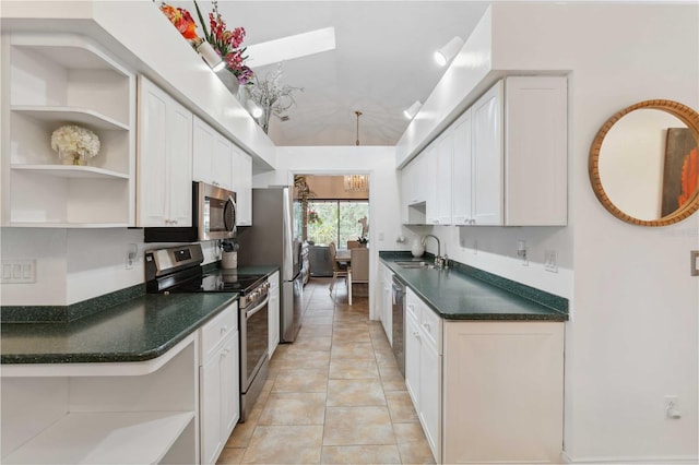 kitchen featuring sink, white cabinets, light tile patterned floors, a notable chandelier, and stainless steel appliances