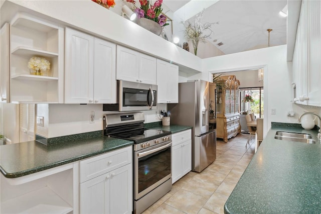 kitchen featuring white cabinetry, appliances with stainless steel finishes, sink, and light tile patterned floors