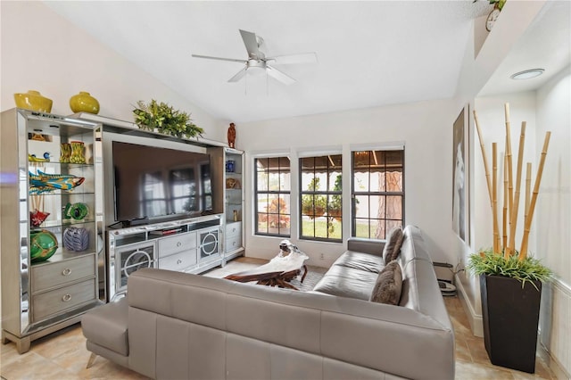 living room with ceiling fan and lofted ceiling