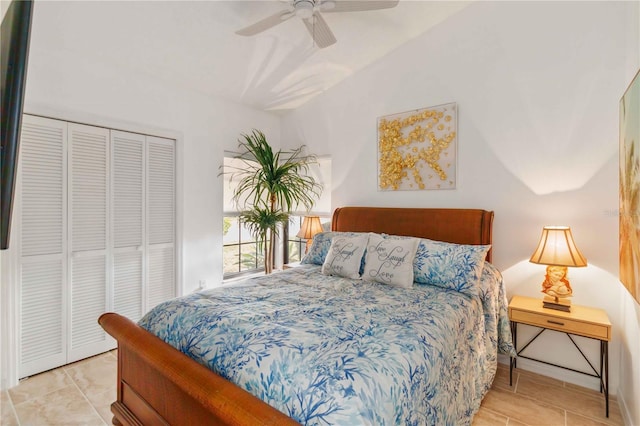 bedroom with ceiling fan, vaulted ceiling, and a closet