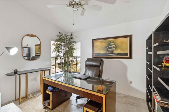 office area featuring vaulted ceiling and ceiling fan