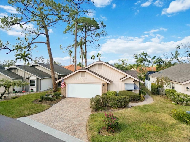 view of front of home featuring a garage and a front lawn