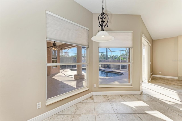 interior space with ceiling fan and light tile patterned flooring