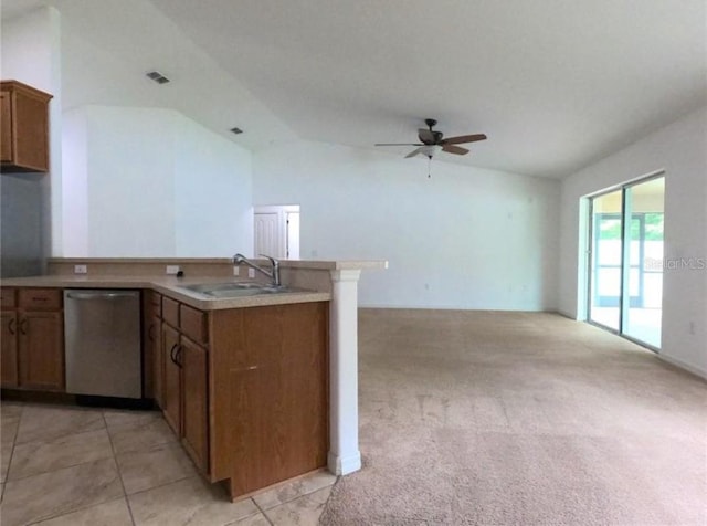 kitchen featuring light carpet, stainless steel dishwasher, sink, kitchen peninsula, and vaulted ceiling