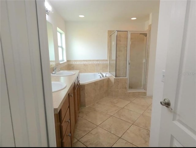 bathroom with vanity, separate shower and tub, and tile patterned flooring