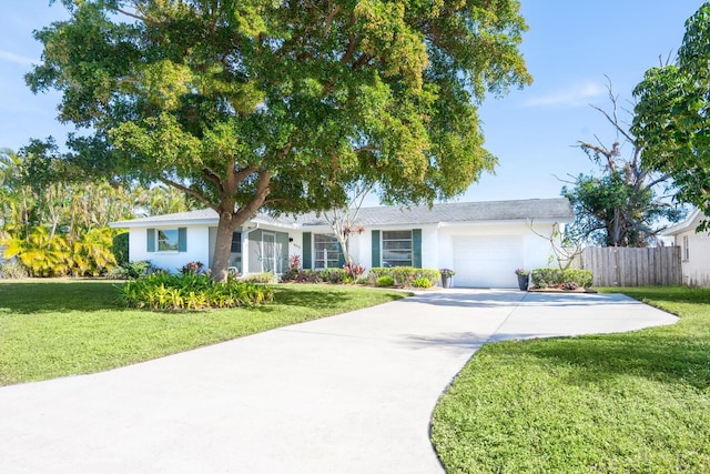 ranch-style house with a garage and a front yard