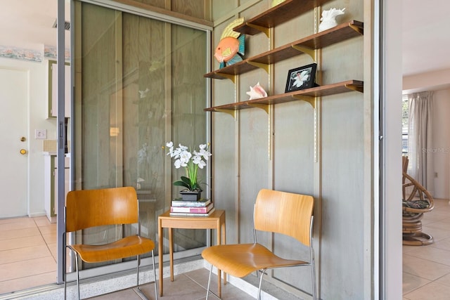 sitting room with light tile patterned floors