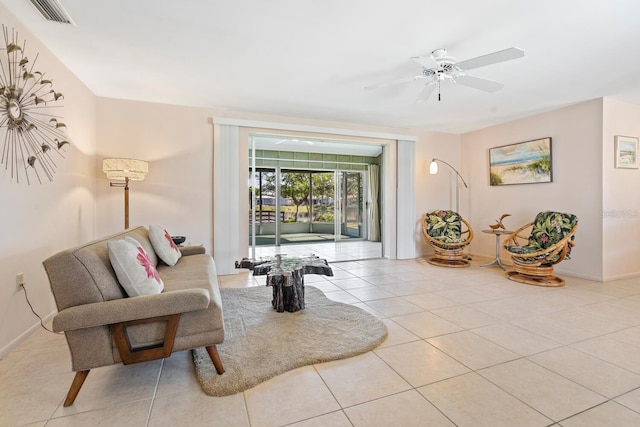 living room featuring light tile patterned floors and ceiling fan