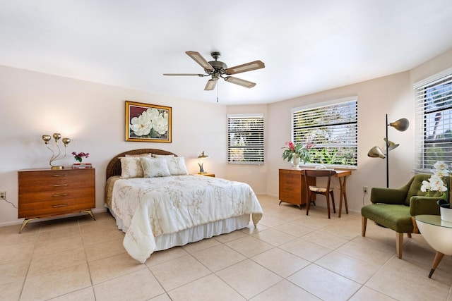 bedroom with multiple windows, light tile patterned floors, and ceiling fan