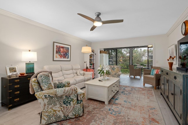 living room with crown molding, ceiling fan, and light hardwood / wood-style floors