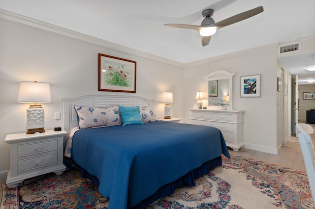 bedroom featuring light tile patterned floors, ornamental molding, and ceiling fan