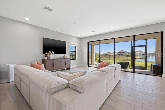 living room with light hardwood / wood-style floors