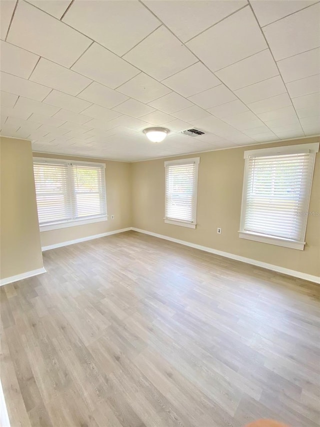 spare room featuring light wood-type flooring