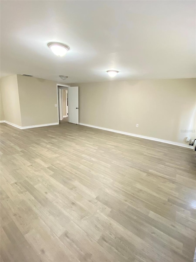 spare room featuring light hardwood / wood-style flooring