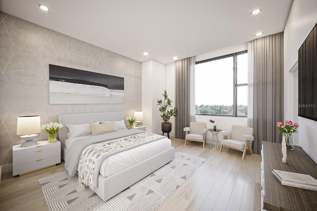 bedroom with tile walls and light hardwood / wood-style floors