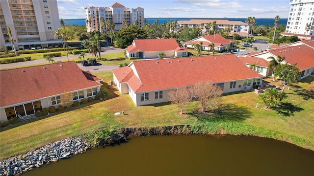 birds eye view of property featuring a water view