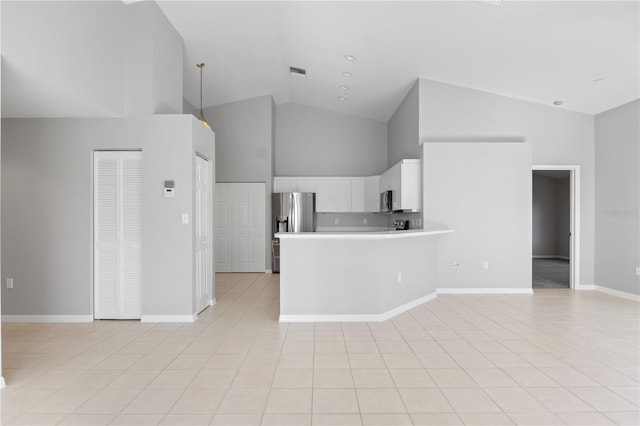 kitchen with pendant lighting, white cabinetry, high vaulted ceiling, stainless steel appliances, and kitchen peninsula