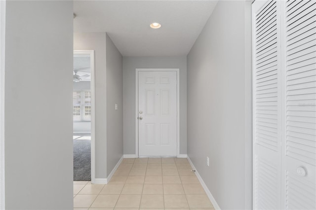 hallway featuring light tile patterned floors