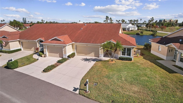 view of front facade featuring central AC unit, a garage, a front yard, and a water view