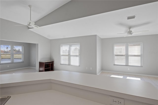 unfurnished living room with vaulted ceiling and ceiling fan