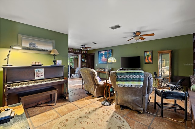 tiled living room with ceiling fan