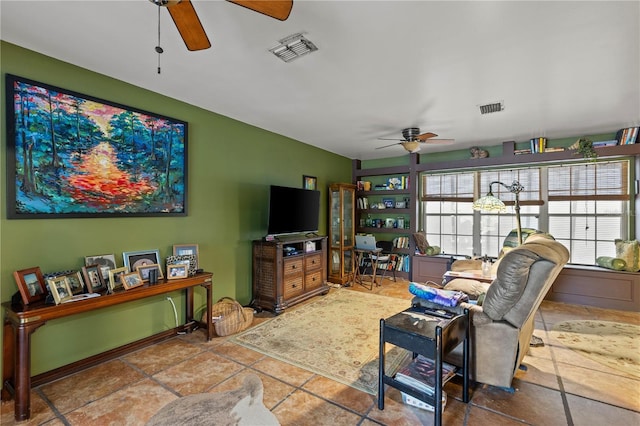 living room featuring tile patterned floors and ceiling fan