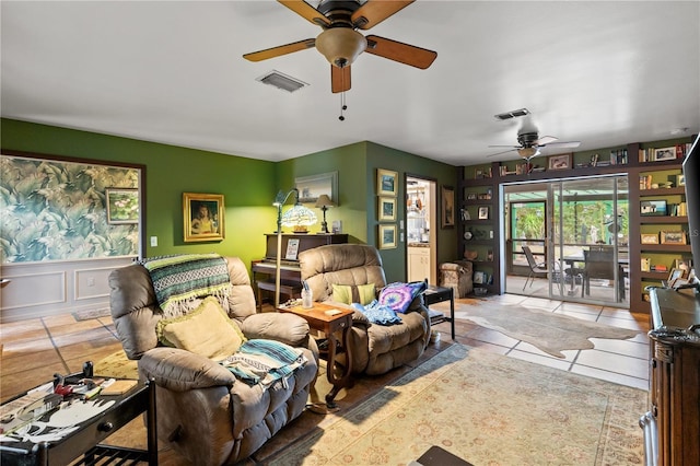 tiled living room featuring ceiling fan