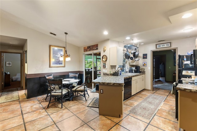 kitchen with sink, black appliances, white cabinets, vaulted ceiling, and kitchen peninsula