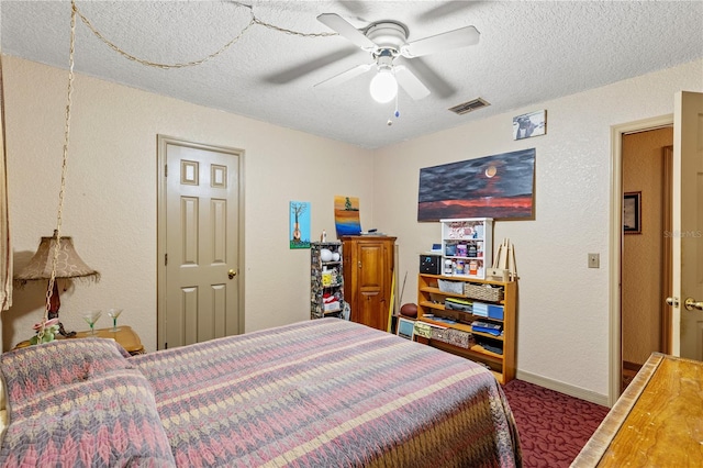 bedroom featuring a textured ceiling and ceiling fan