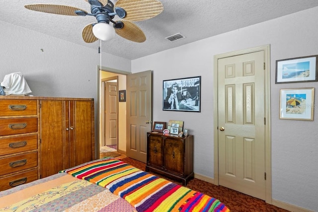 bedroom featuring a textured ceiling and ceiling fan