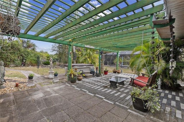 view of patio / terrace featuring a pergola and a hot tub