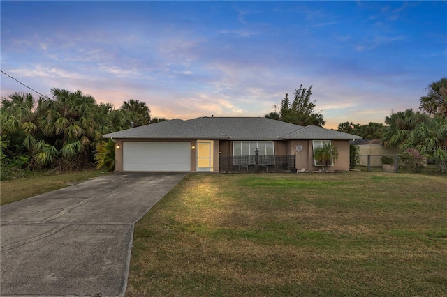 230 Salisbury St, Port Charlotte, FL 33954 - single story home with fence, concrete driveway, a front yard, and a garage