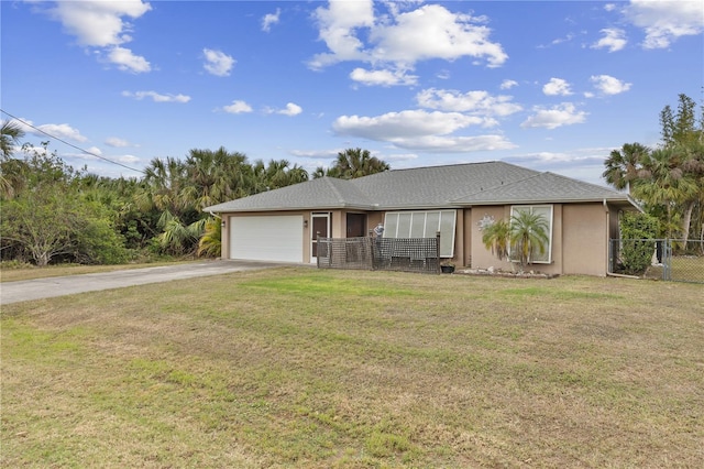 230 Salisbury St, Port Charlotte, FL 33954 - ranch-style house featuring a front lawn, driveway, fence, an attached garage, and stucco siding