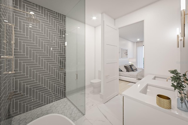 bathroom with vanity, a shower with shower door, and toilet