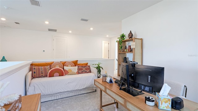 carpeted living area with recessed lighting and visible vents