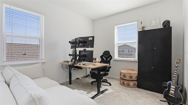 carpeted home office with baseboards