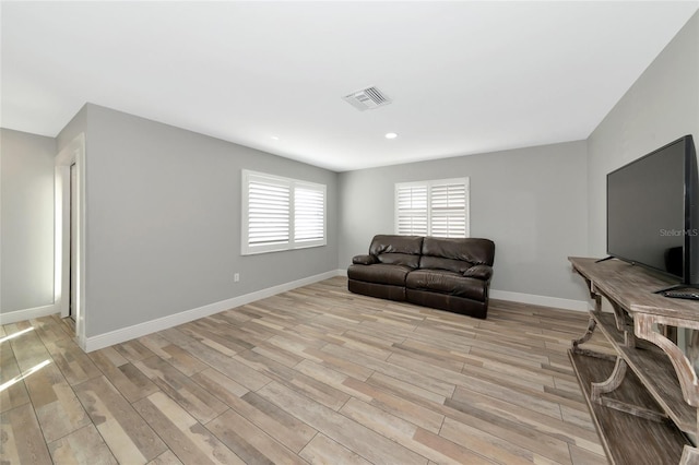 living room with light hardwood / wood-style floors